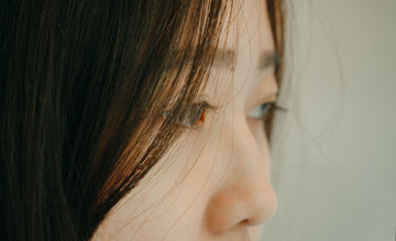 Close up of a woman's nose and eyes — illustrating nose shape considerations for choosing the right nasal strip