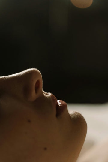 Close-up of a person's nose showing nasal anatomy relevant to deviated septum