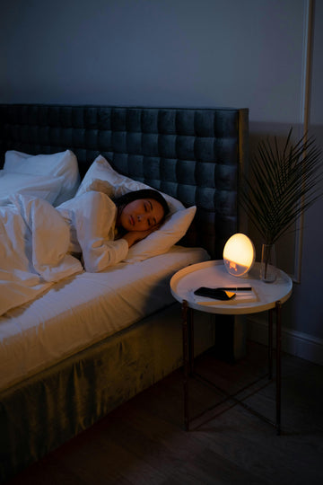 Person sleeping peacefully in bed - managing sleep with a deviated septum